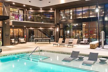 Resort style pool with sun deck & grill area